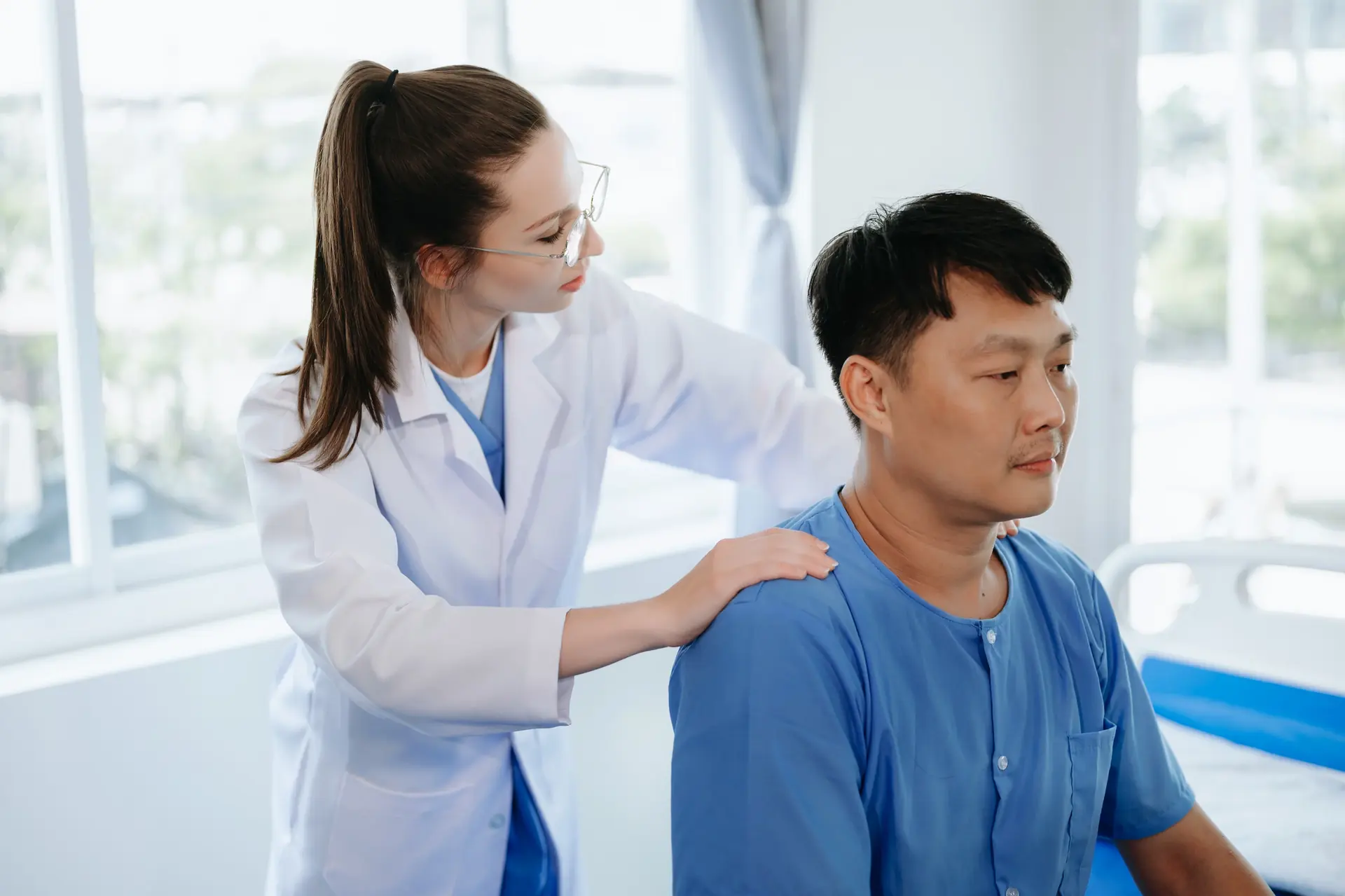 A clinician consulting with a patient