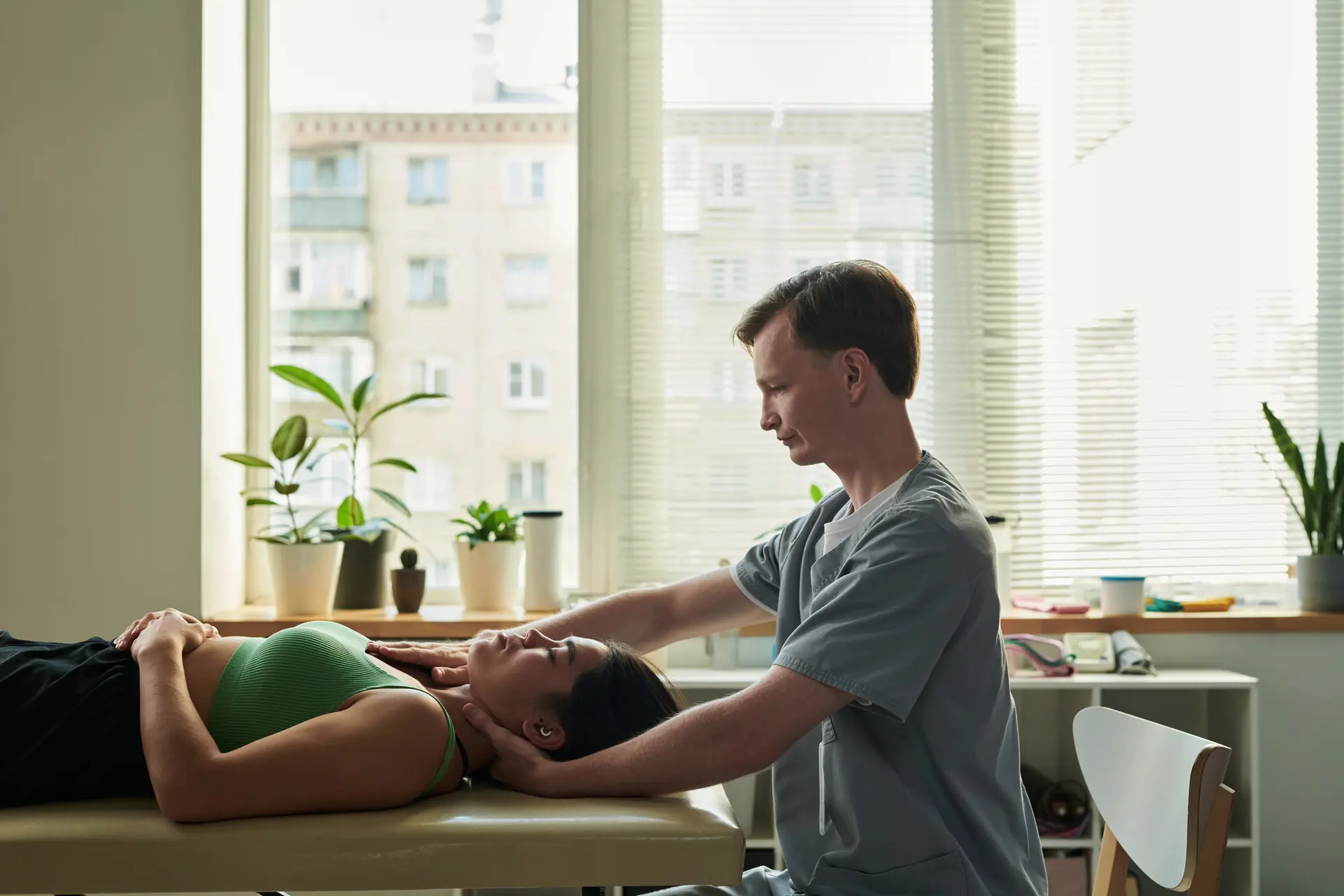 A chiropractor conducting an adjustment in a modern clinic