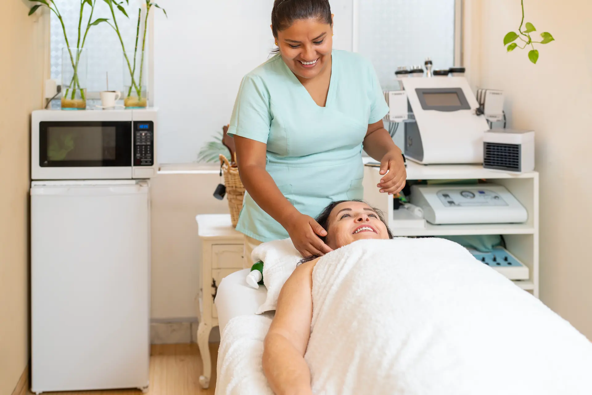 A masseur attending a client in a wellness spa