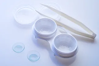 Contact lens cases and solution placed on clean surface