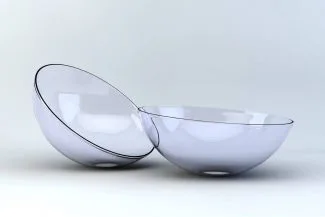 Pair of scleral contact lenses placed on clean white surface