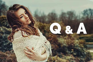 Woman outdoors wrapped in shawl with Q and A text beside her